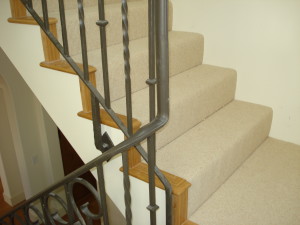 Bamboo with sisal carpet on open end stair case